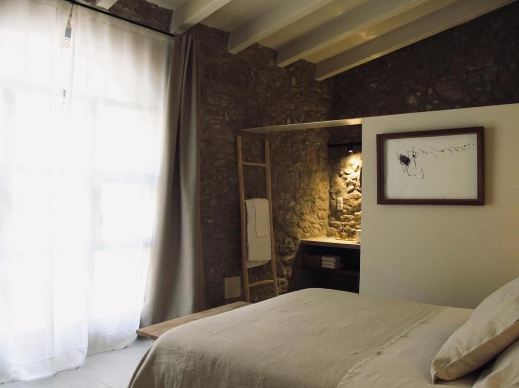 Postel nebo postele na pokoji v ubytování CAN SAFRA