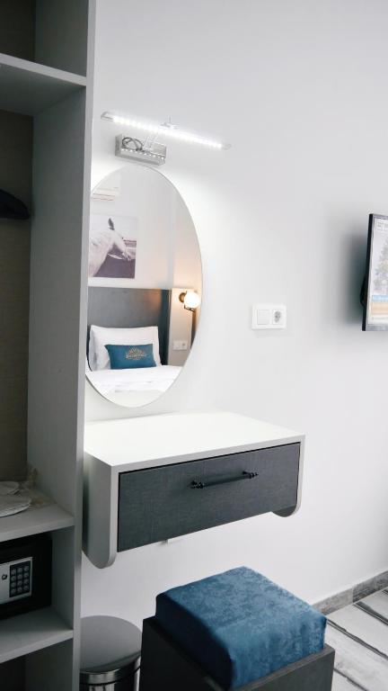Postel nebo postele na pokoji v ubytování Nefis Hotel City