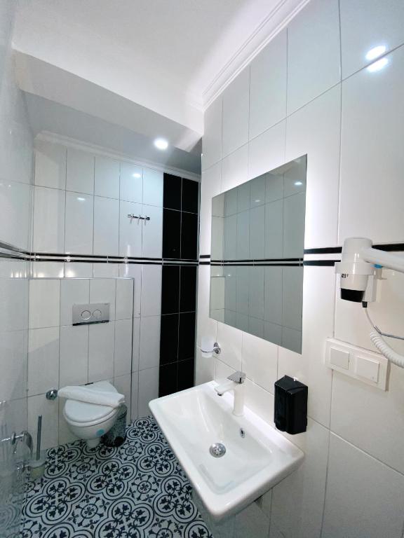 Koupelna v ubytování Nefis Hotel City