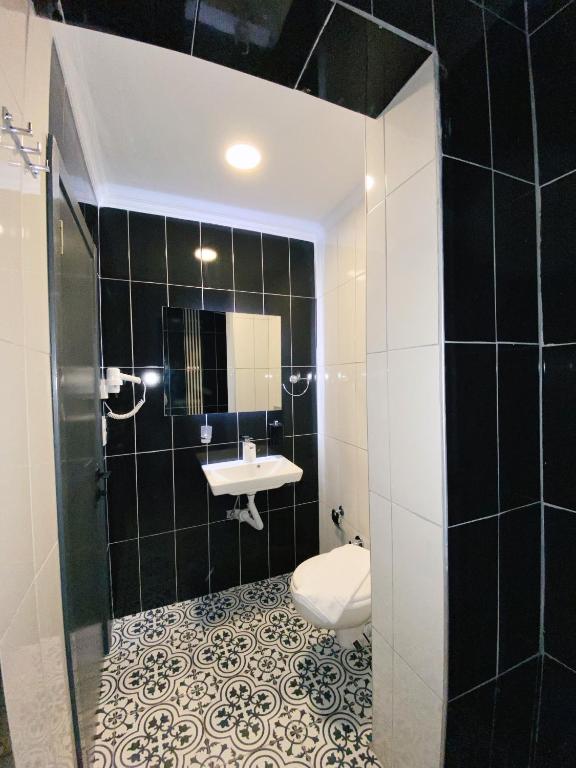 Koupelna v ubytování Nefis Hotel City