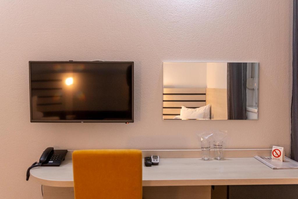 TV i/ili multimedijalni sistem u objektu Garni Hotel 11tica DM