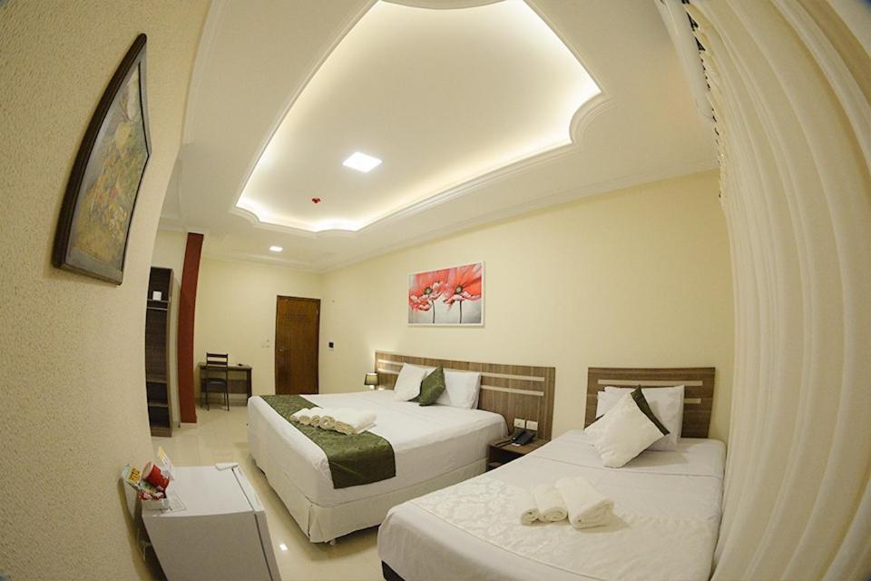 Postel nebo postele na pokoji v ubytování Hotel del Parque