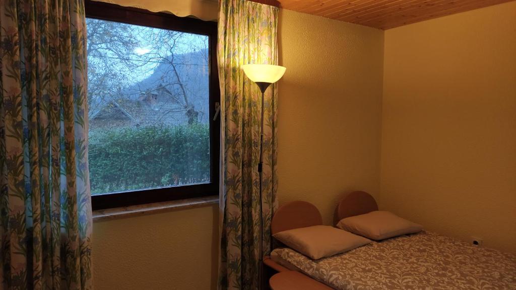 Postel nebo postele na pokoji v ubytování Alp House