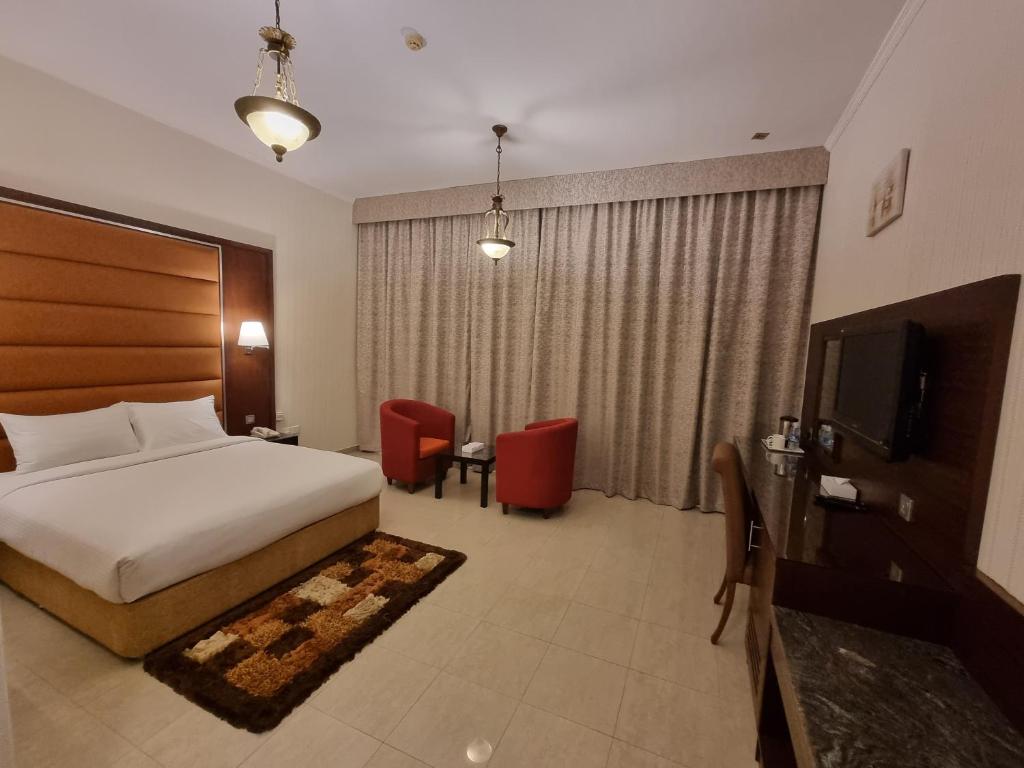 Postel nebo postele na pokoji v ubytování Vista City Hotel