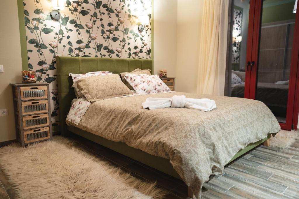 Postel nebo postele na pokoji v ubytování Olive Tree Suites