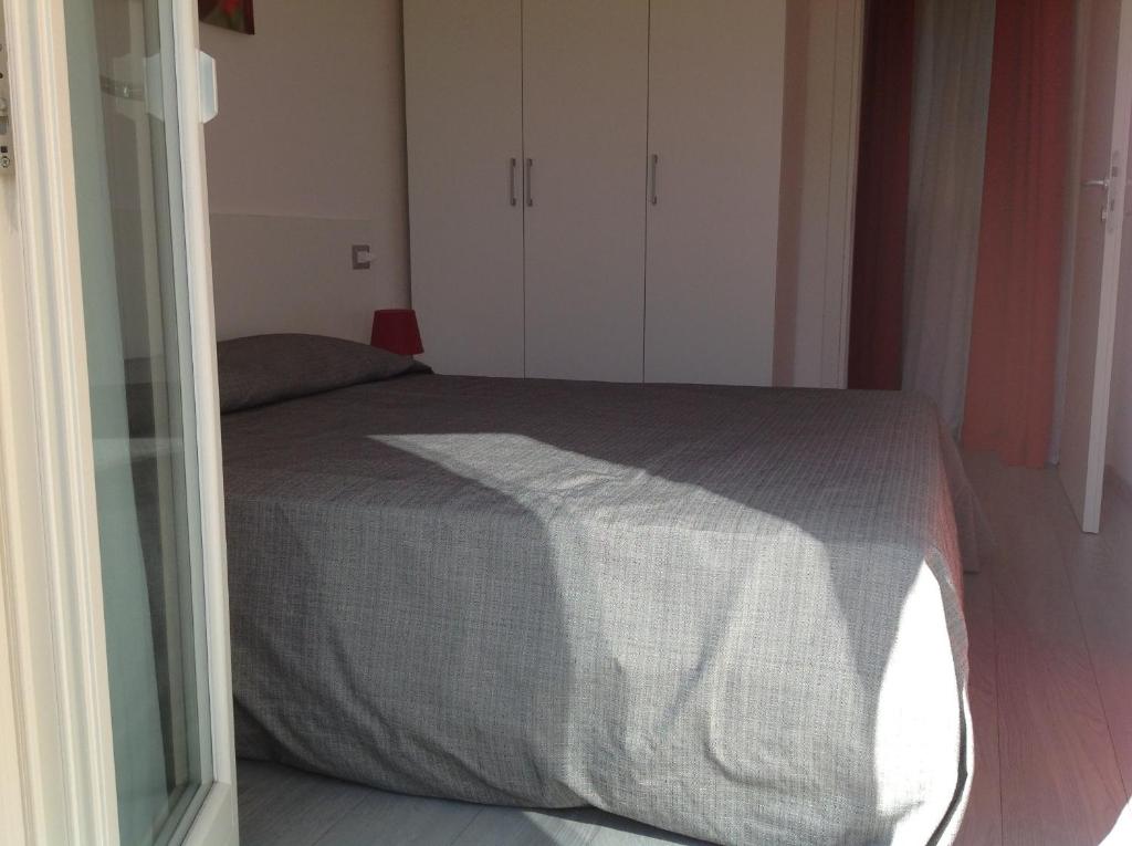 Łóżko lub łóżka w pokoju w obiekcie Appartamenti Villa Padania