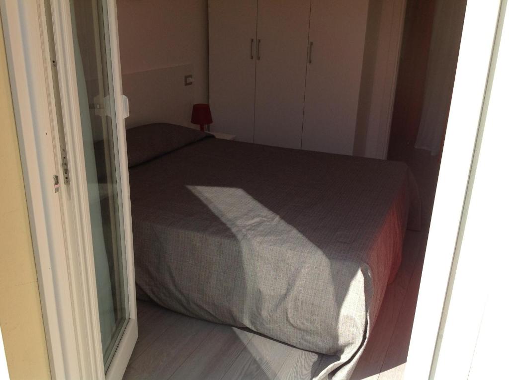 Łóżko lub łóżka w pokoju w obiekcie Appartamenti Villa Padania