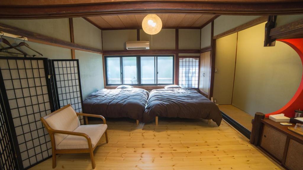 Postel nebo postele na pokoji v ubytování Shibu Onsen Koishiya Ryokan