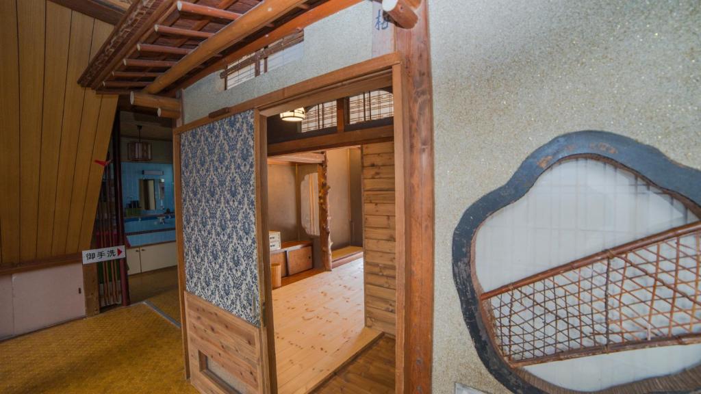 Postel nebo postele na pokoji v ubytování Shibu Onsen Koishiya Ryokan