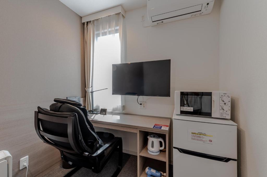 TV a/nebo společenská místnost v ubytování HOTEL R9 The Yard Kamisu