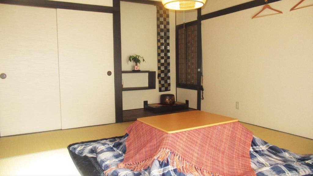 Postel nebo postele na pokoji v ubytování 松本はなれ Matsumoto HANARE - Japanese style private bedroom Guest hause