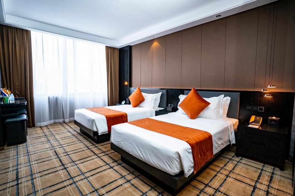 Postel nebo postele na pokoji v ubytování OCEAN HOTEL