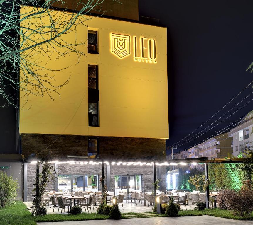 a building with a lit up sign on the side of it at Leo Suites in Bursa