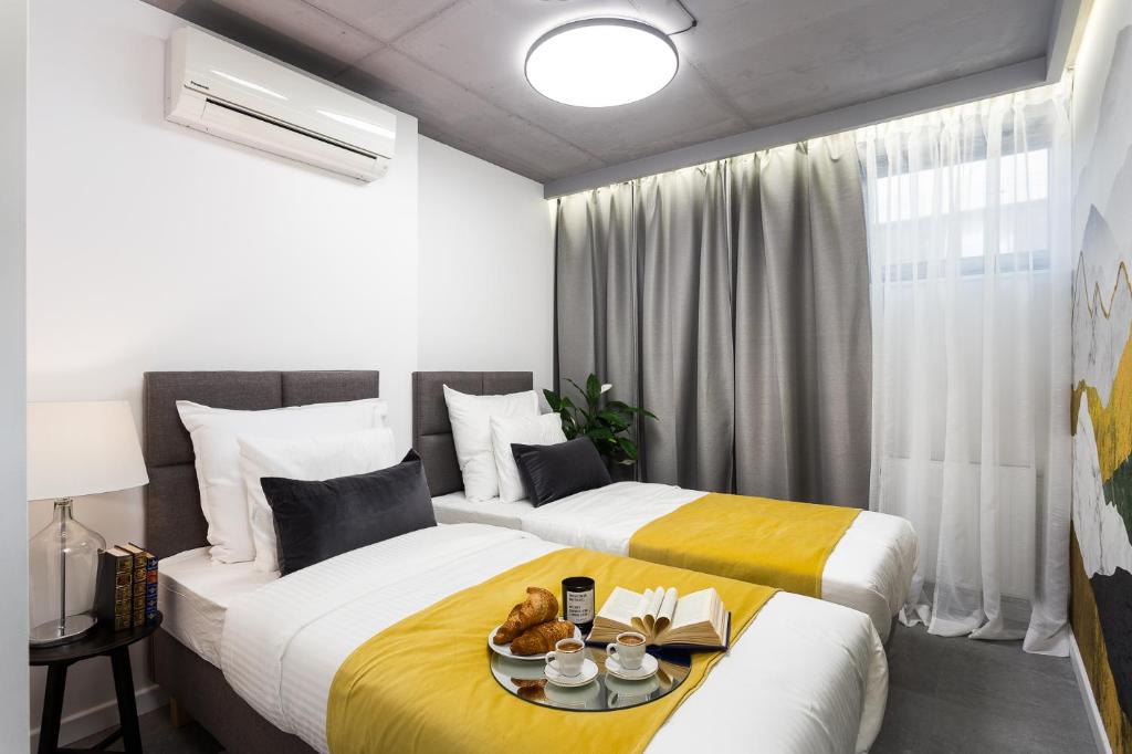 Posteľ alebo postele v izbe v ubytovaní Family Center Apartments