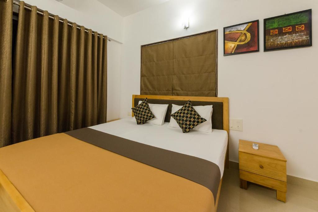 Posteľ alebo postele v izbe v ubytovaní Aashirwad Serviced Residences