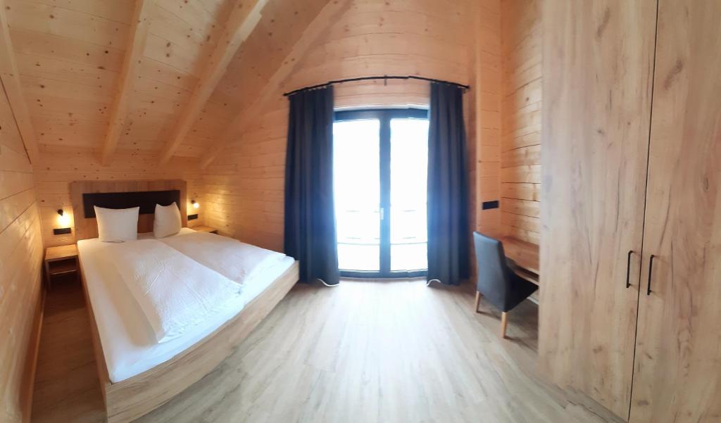 Posteľ alebo postele v izbe v ubytovaní Alpenchalets Nassfeld