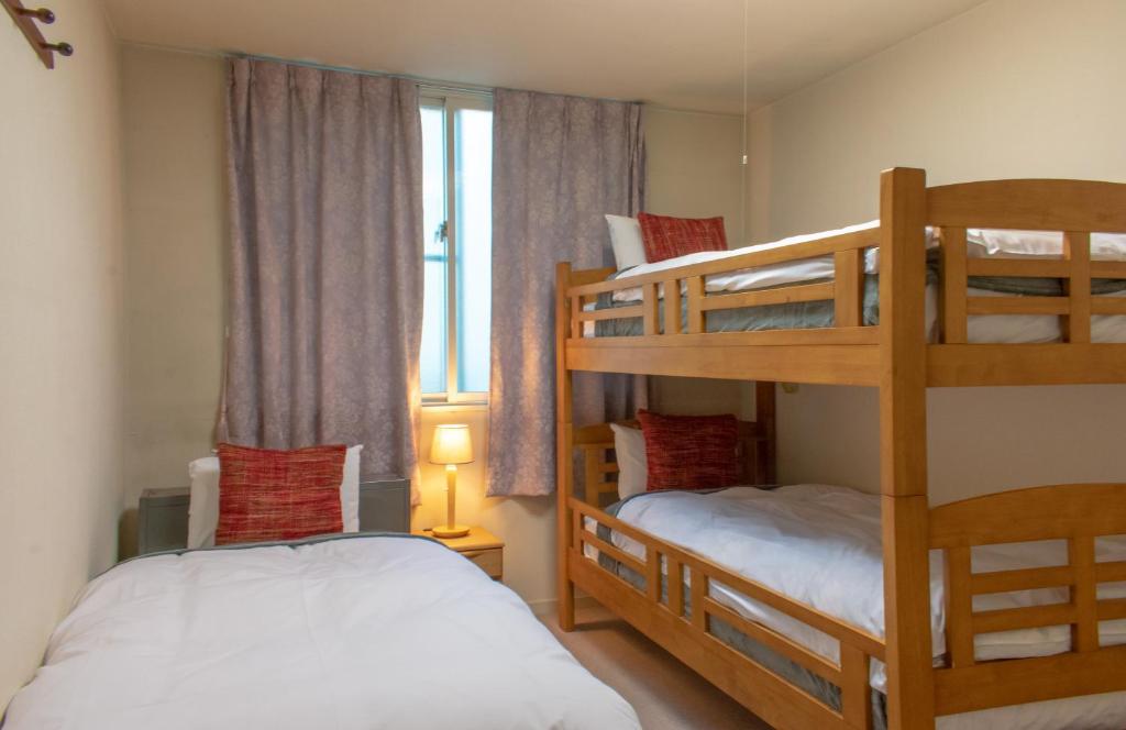 Postel nebo postele na pokoji v ubytování T Square Hakuba