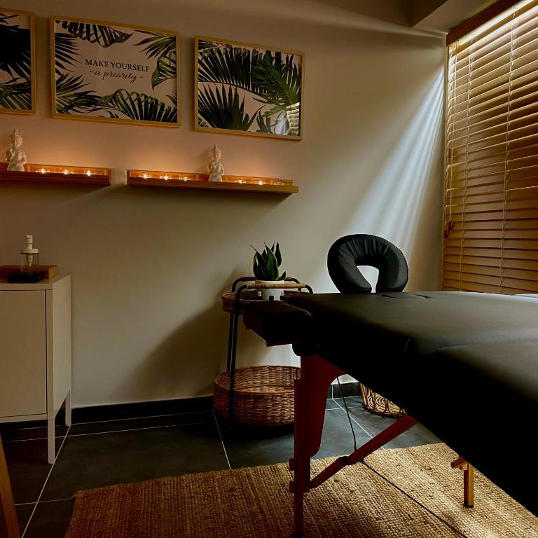 a living room with a ping pong table and plants at Athenian Riviera Hotel& Suites in Athens