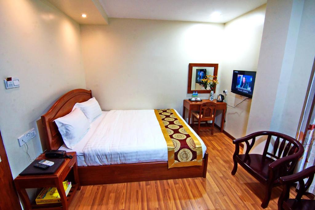 Letto o letti in una camera di Royal Pearl Hotel