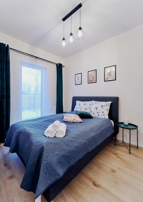 Posteľ alebo postele v izbe v ubytovaní LAGUNA Apartament Polanica Residence 5