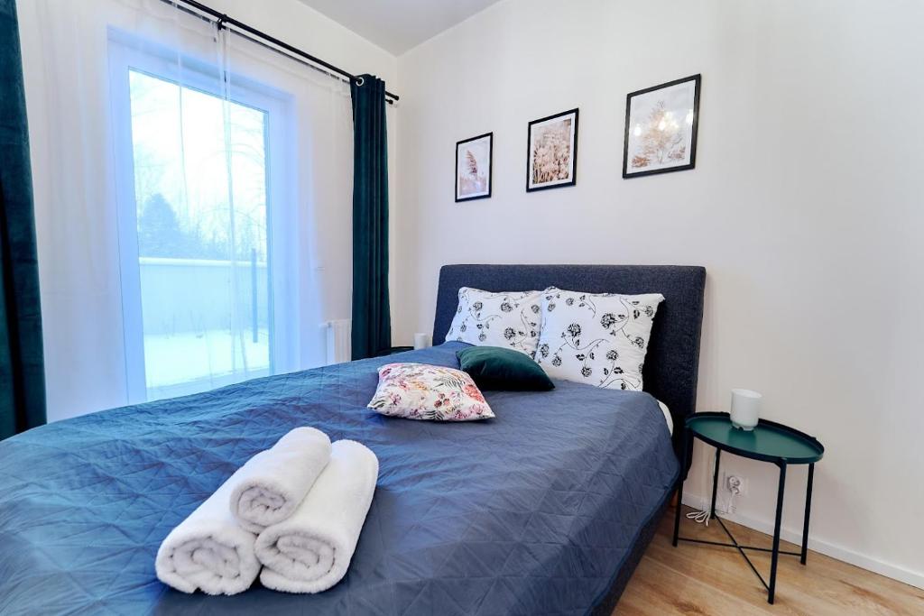 Posteľ alebo postele v izbe v ubytovaní LAGUNA Apartament Polanica Residence 5