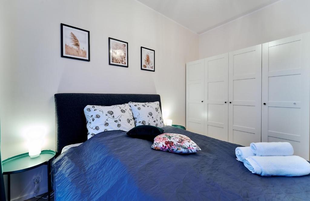Posteľ alebo postele v izbe v ubytovaní LAGUNA Apartament Polanica Residence 5