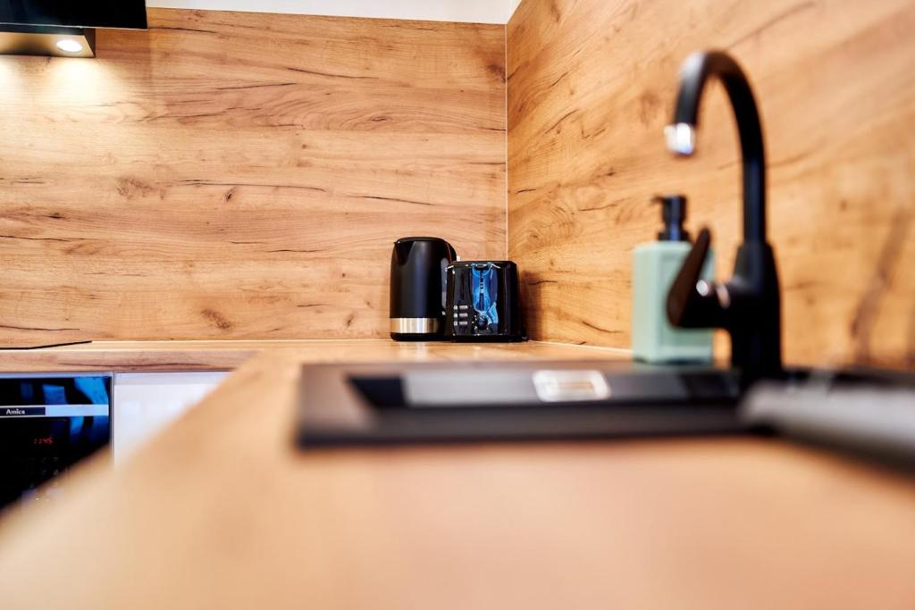 Kuchyňa alebo kuchynka v ubytovaní LAGUNA Apartament Polanica Residence 5