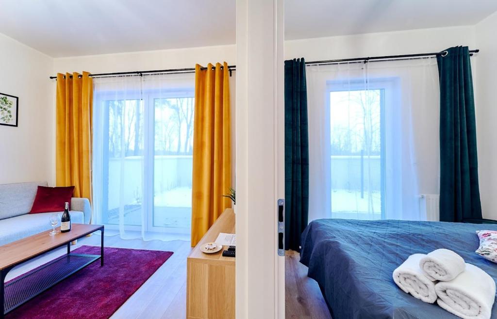 Posteľ alebo postele v izbe v ubytovaní LAGUNA Apartament Polanica Residence 5