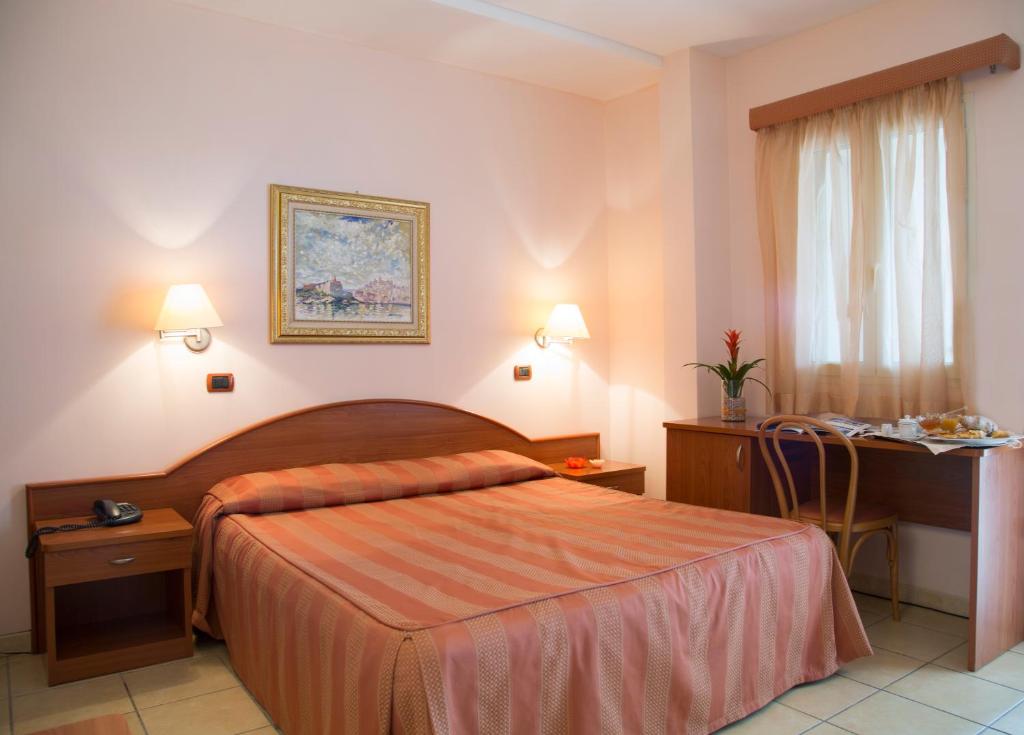 Postel nebo postele na pokoji v ubytování Garden Hotel Ripa