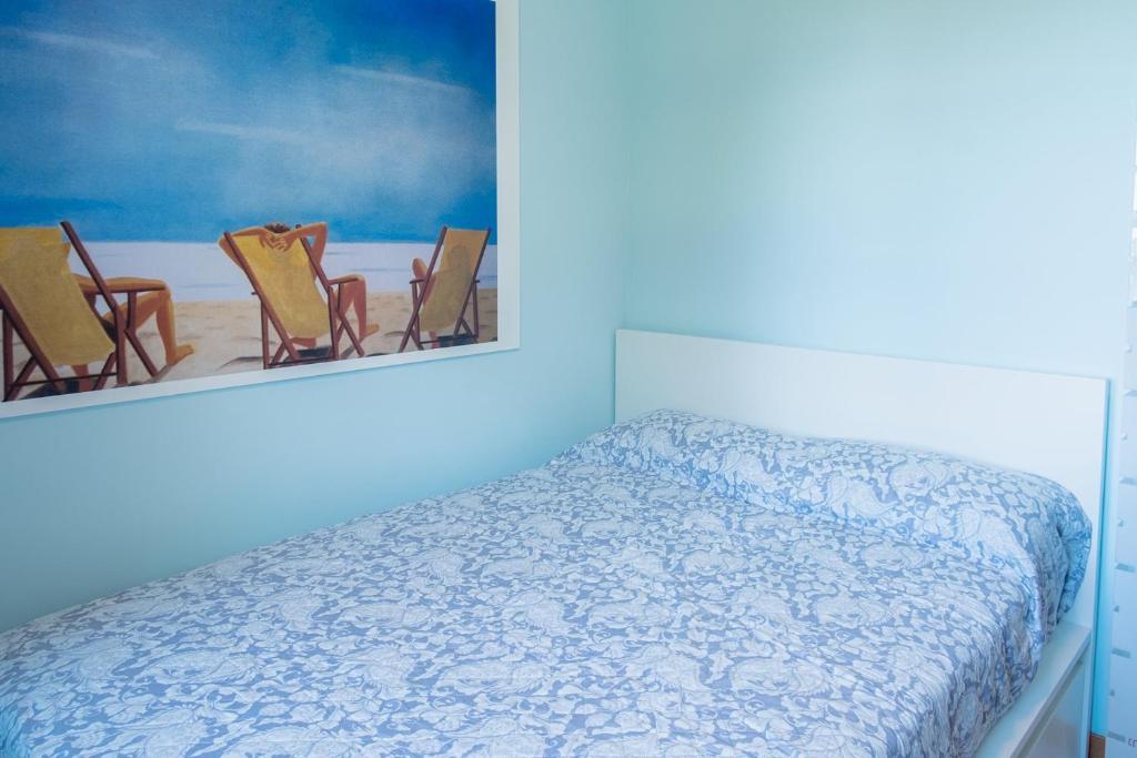 A bed or beds in a room at La Casa Sul Porto - Italian Homing