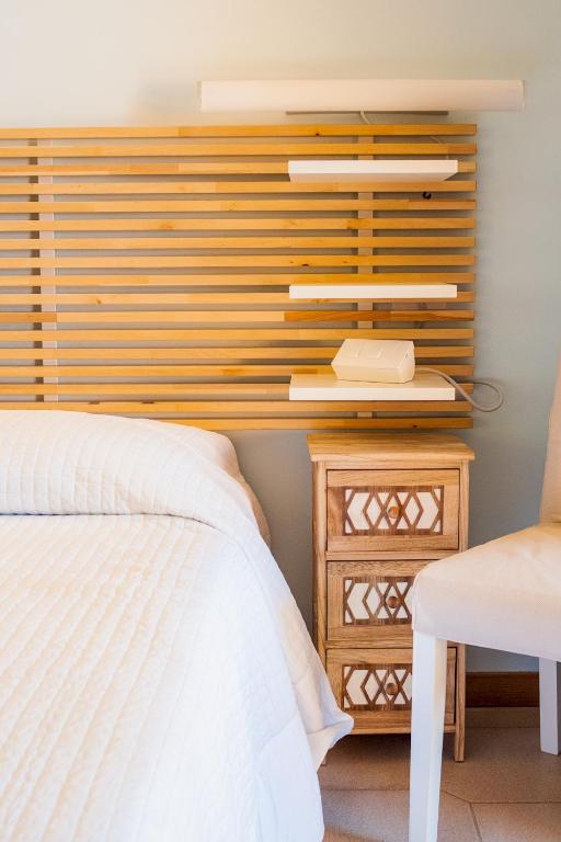 A bed or beds in a room at La Casa Sul Porto - Italian Homing