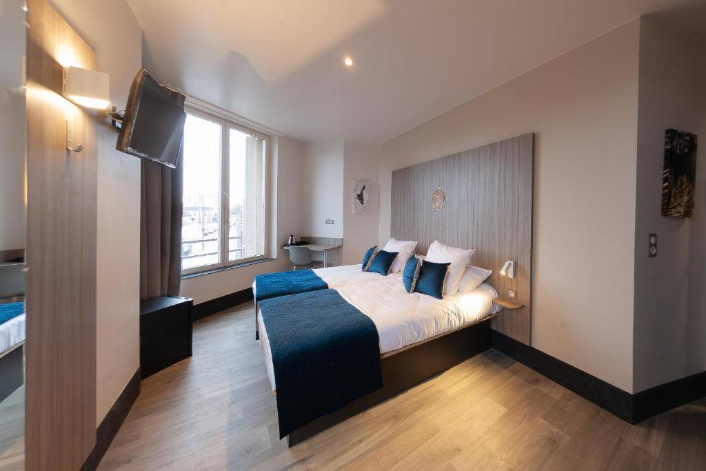 Postel nebo postele na pokoji v ubytování Hôtel Nancy Gare-Congrés