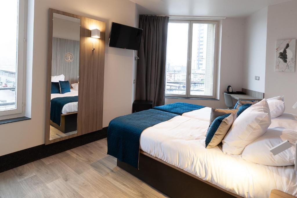 Postel nebo postele na pokoji v ubytování Hôtel Nancy Gare-Congrés