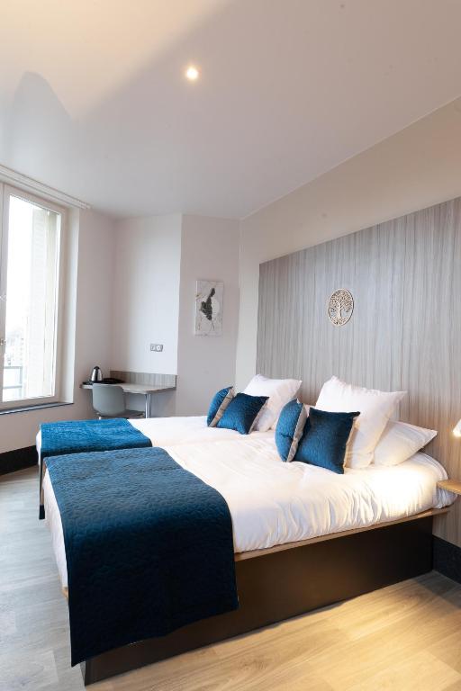 Postel nebo postele na pokoji v ubytování Hôtel Nancy Gare-Congrés