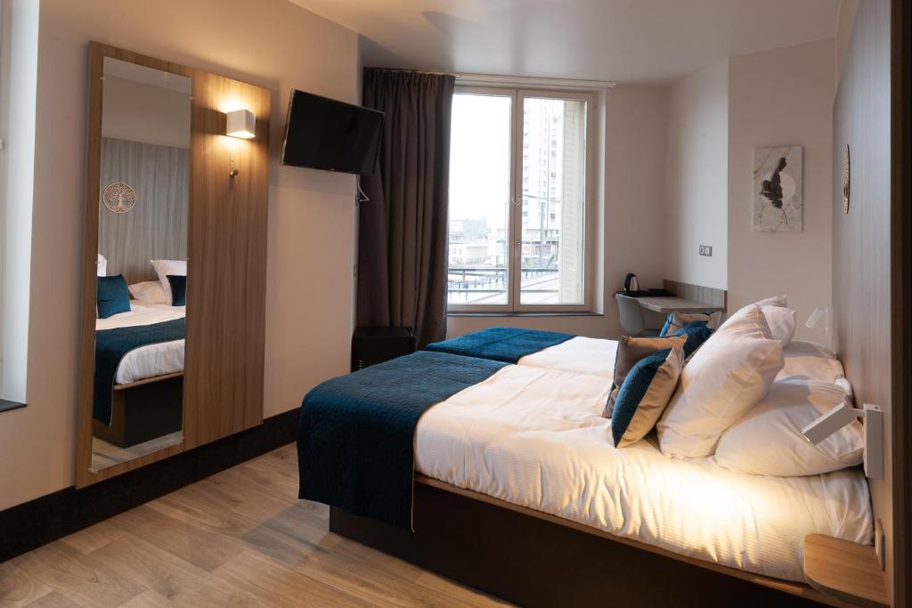 Postel nebo postele na pokoji v ubytování Hôtel Nancy Gare-Congrés