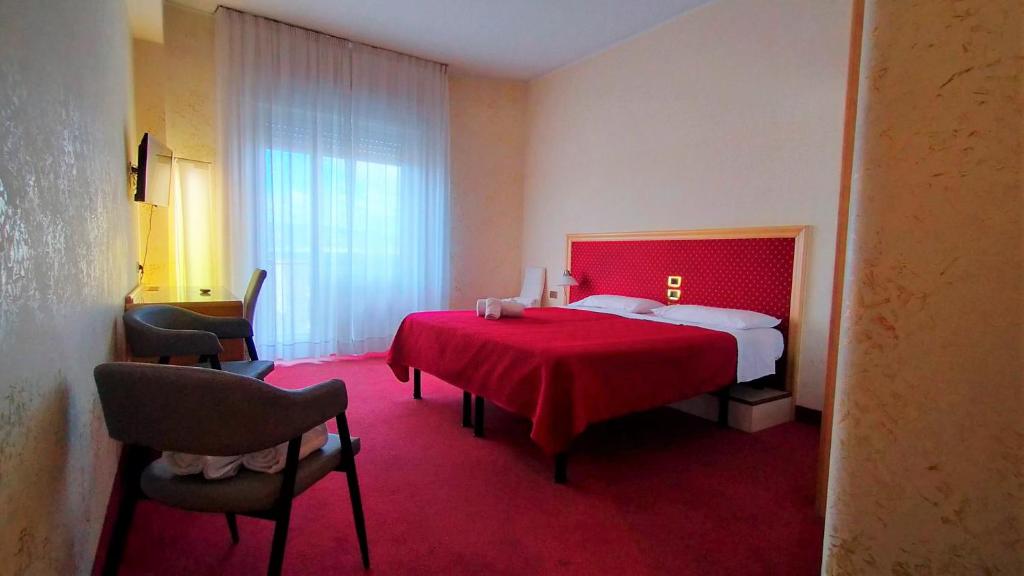 Säng eller sängar i ett rum på Hotel Palace Masoanri's