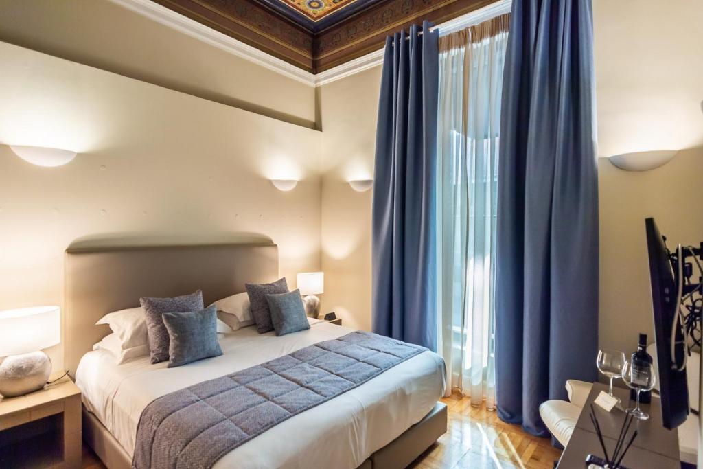 Posteľ alebo postele v izbe v ubytovaní 33SolonosSuites