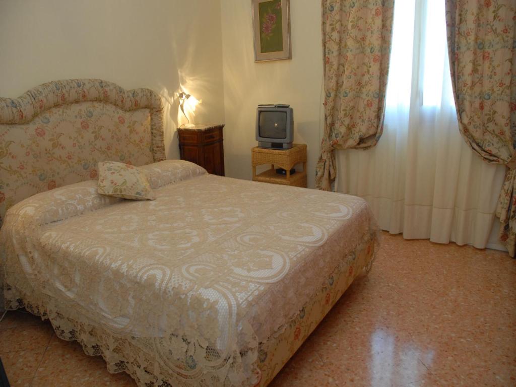 A bed or beds in a room at Casa Rachele