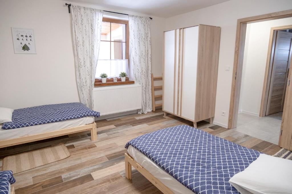 Postel nebo postele na pokoji v ubytování Jachovka