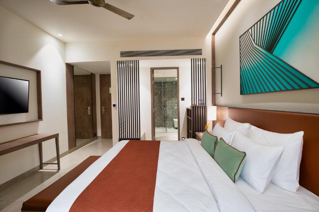 Postel nebo postele na pokoji v ubytování Amoravida By 7 Apple Resorts, Goa