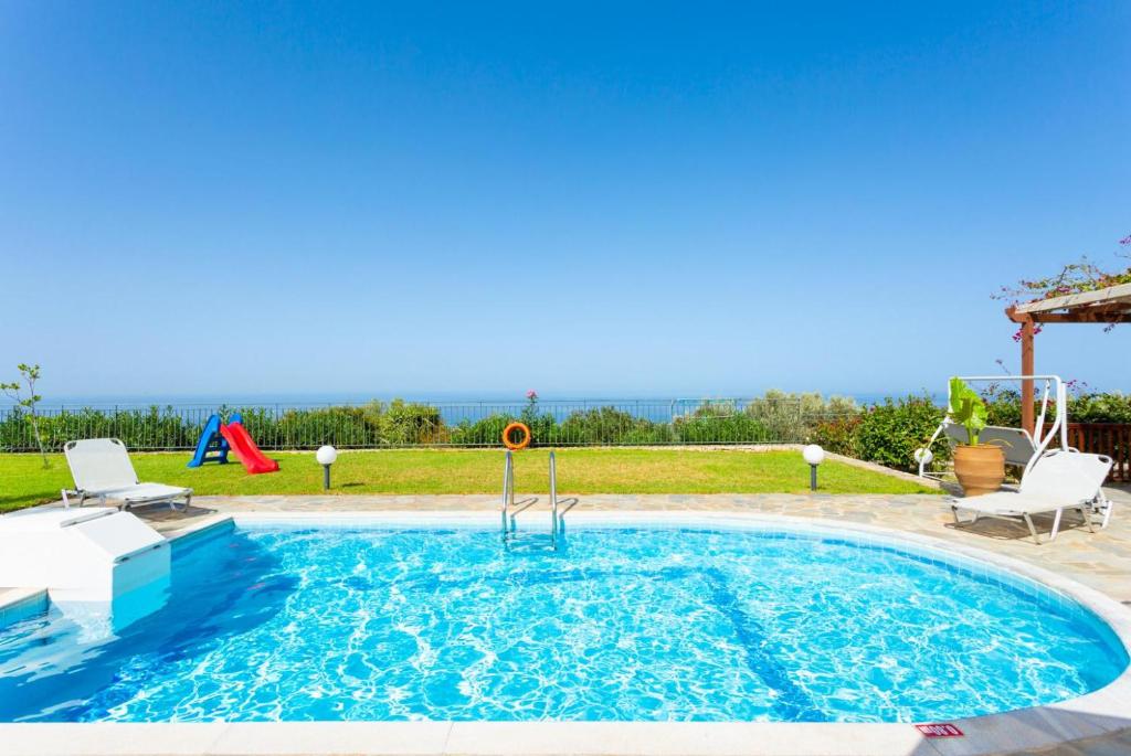 The swimming pool at or close to Villa Garifallia