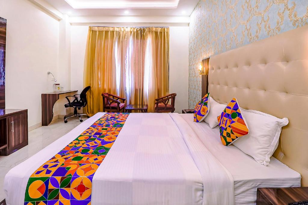 Postel nebo postele na pokoji v ubytování FabHotel Swess Grand