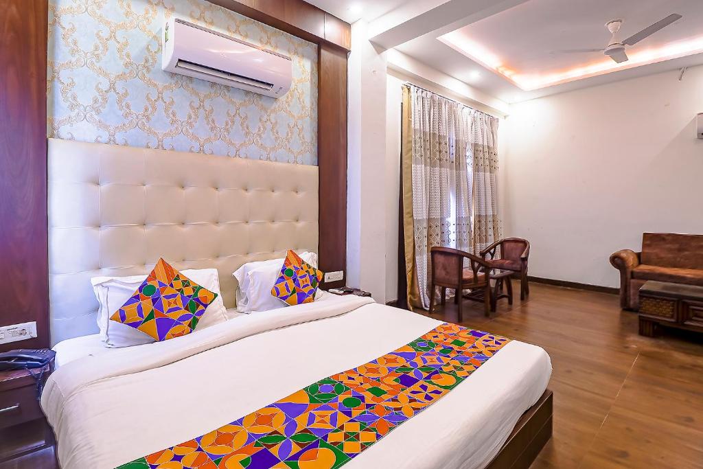 Postel nebo postele na pokoji v ubytování FabHotel Swess Grand