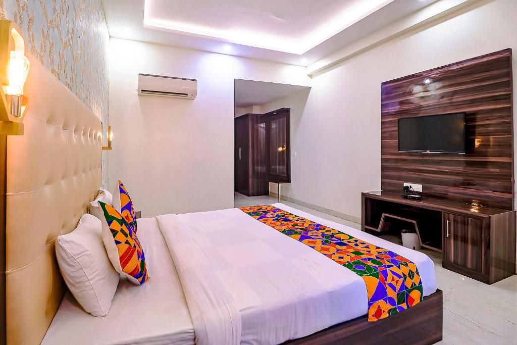 Postel nebo postele na pokoji v ubytování FabHotel Swess Grand
