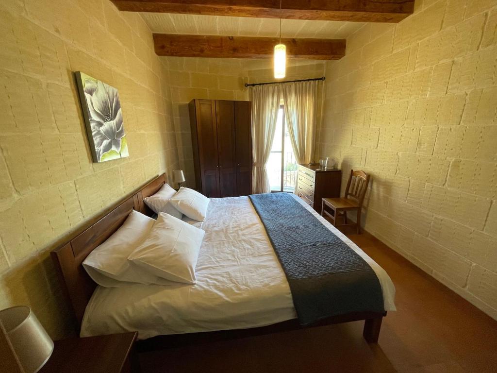 Postel nebo postele na pokoji v ubytování Gilju B&B