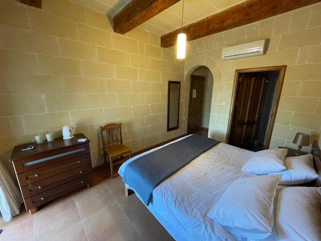 Postel nebo postele na pokoji v ubytování Gilju B&B