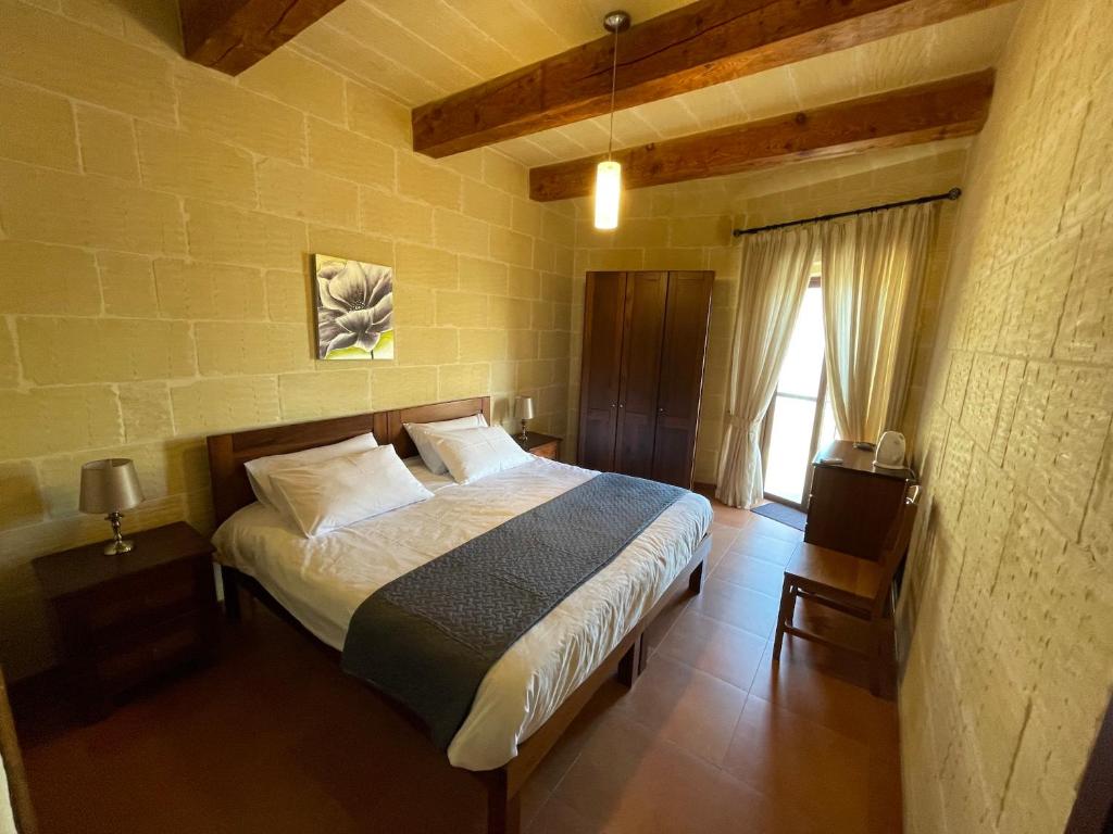Postel nebo postele na pokoji v ubytování Gilju B&B