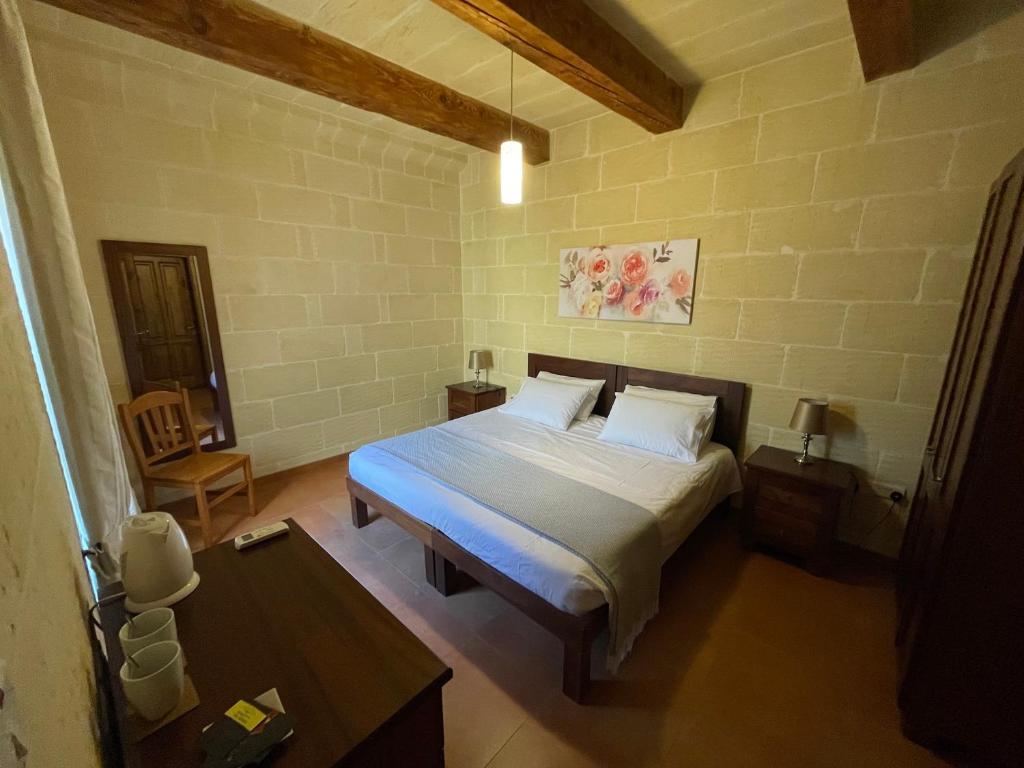 Postel nebo postele na pokoji v ubytování Gilju B&B
