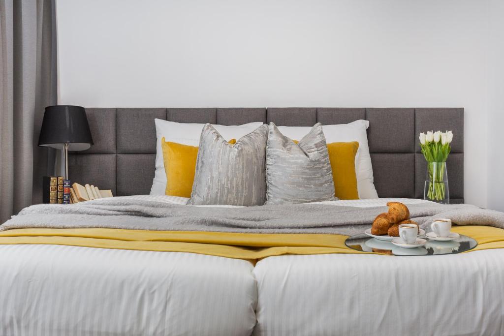 Posteľ alebo postele v izbe v ubytovaní Family Center Apartments