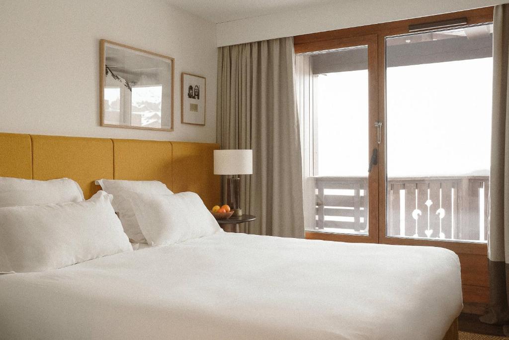 Postel nebo postele na pokoji v ubytování Le Val Thorens, a Beaumier hotel